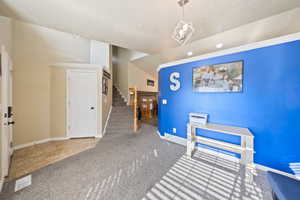 Carpeted dining area featuring stairway, tile patterned flooring, recessed lighting, and ornamental molding