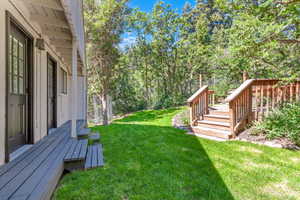 View of yard with a deck