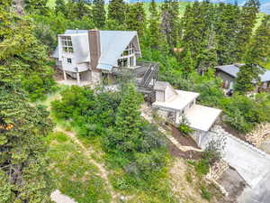View from above of property featuring a forest