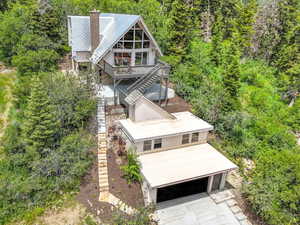 View from above of property with a heavily wooded area