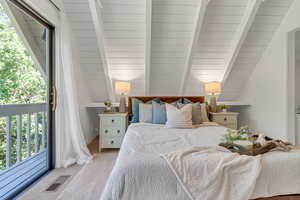Bedroom featuring multiple windows