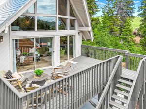 Wooden terrace with stairs and a mountain view