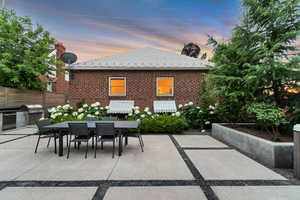 View of patio featuring outdoor dining space and area for grilling