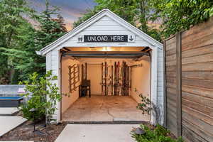 Outdoor structure at dusk featuring a garage