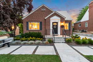 Bungalow-style house featuring brick siding