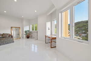 Corridor with recessed lighting and marble tiled floors