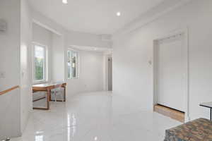 Spare room featuring recessed lighting and light marble finish floors