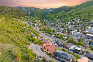 Aerial view at dusk of a mountain view and a view of trees