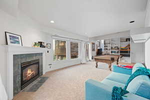 Recreation room with a fireplace, carpet floors, pool table, and recessed lighting