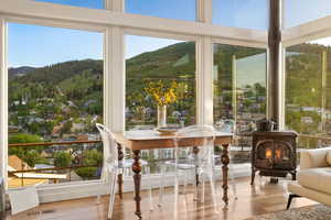 Sunroom with a mountain view