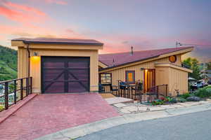 View of front of home with a shingled roof