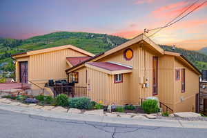 View of front of property featuring a mountain view and board and batten siding
