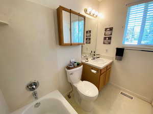 Full bath with vanity and toilet