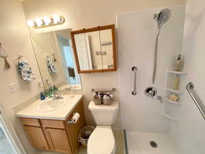 Bathroom featuring a shower and vanity