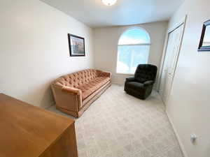 Sitting room with light colored carpet