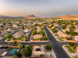 Aerial perspective of suburban area featuring a mountain backdrop