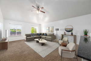 Living room featuring carpet flooring and ceiling fan