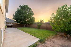 Fenced backyard with a patio