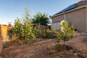 Fenced backyard with a garden