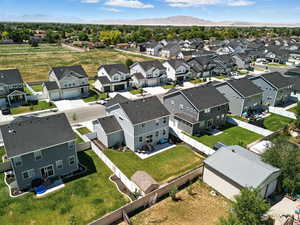 Aerial view of residential area featuring a mountain backdrop
