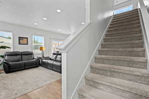 Carpeted stairs to second level