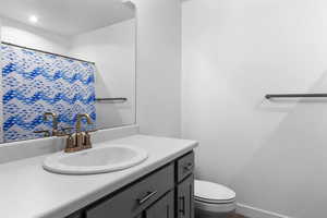 Full bath with vanity and a shower bathtub combination