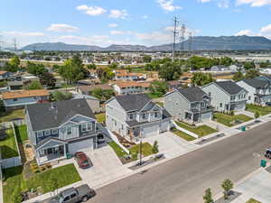 Aerial view of residential area featuring mountains