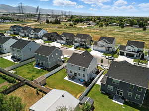 Aerial perspective of suburban area with a mountainous background