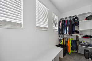 Walk in closet with carpet flooring