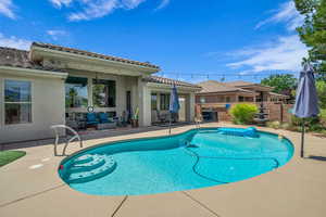 View of swimming pool with an outdoor living space, a patio area, and a ceiling fan