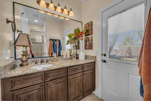 Bathroom with vanity and tile patterned flooring