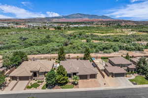 Aerial perspective of suburban area with a mountainous background