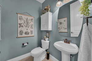 Bathroom featuring toilet and tile patterned floors