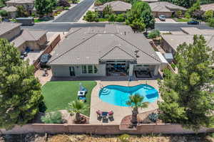 View of swimming pool featuring a patio, a residential view, and a fenced backyard