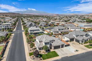 Aerial perspective of suburban area with a mountainous background