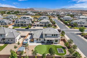 Aerial perspective of suburban area with a mountainous background