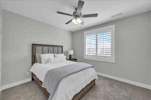 Bedroom featuring carpet floors and ceiling fan