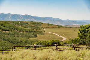 View of mountain backdrop with rural landscape