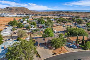 Aerial perspective of suburban area featuring a mountainous background