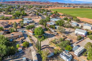 Aerial perspective of suburban area with a mountainous background and a golf course