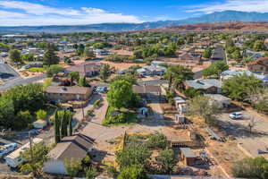 View of property location featuring a mountainous background and nearby suburban area