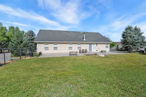 Rear view of house featuring a patio area