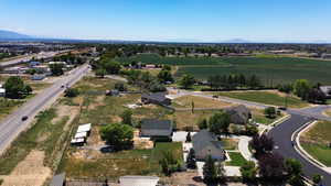 Aerial view of property's location featuring rural landscape and a mountainous background