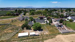 Aerial perspective of suburban area featuring a mountain backdrop