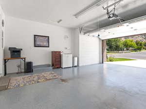 Garage featuring a garage door opener