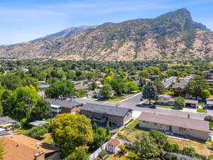 View of mountain backdrop featuring nearby suburban area