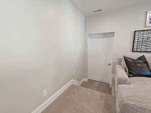 Carpeted bedroom with baseboards