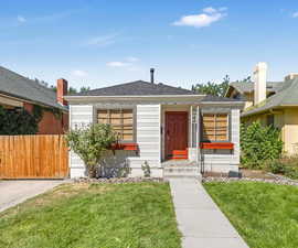 Bungalow-style home with a shingled roof