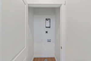 Laundry area featuring electric dryer hookup, light wood finished floors, and hookup for a washing machine