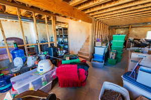 Unfinished basement featuring stairs